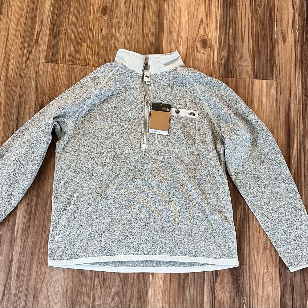 The North Face quarter zip, 1/4 zip. Brand new with tags.